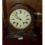 A Victorian walnut striking mantel clock with painted white dial and simple gong-striking