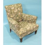 A late-19th/early-20th century upholstered armchair with turned arms and front legs and a stained