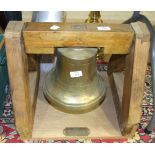 A bronze bell, inscribed on a plaque on the stand 'Recovered from an unknown wreck, Alderney