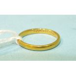 A 22ct gold wedding band, size K, 2.2g.