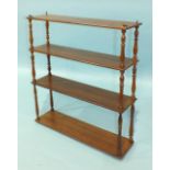 A set of late-19th century mahogany four-tier hanging wall shelves, each tier separated by turned