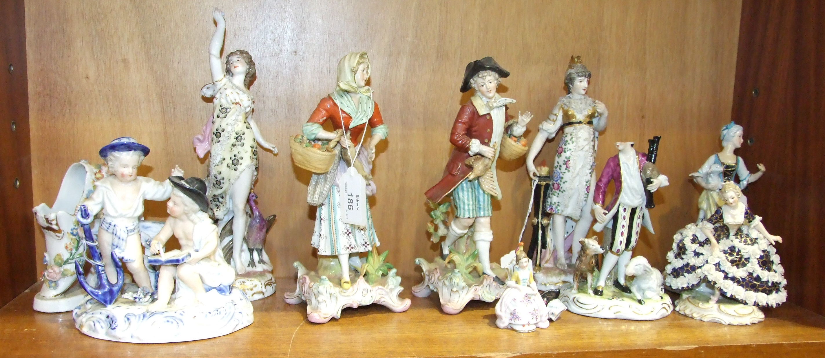 A collection of 19th century Continental porcelain figures, (numerous damages).