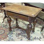 An oak hall table, the rectangular top with carved edge decoration above a frieze drawer, on