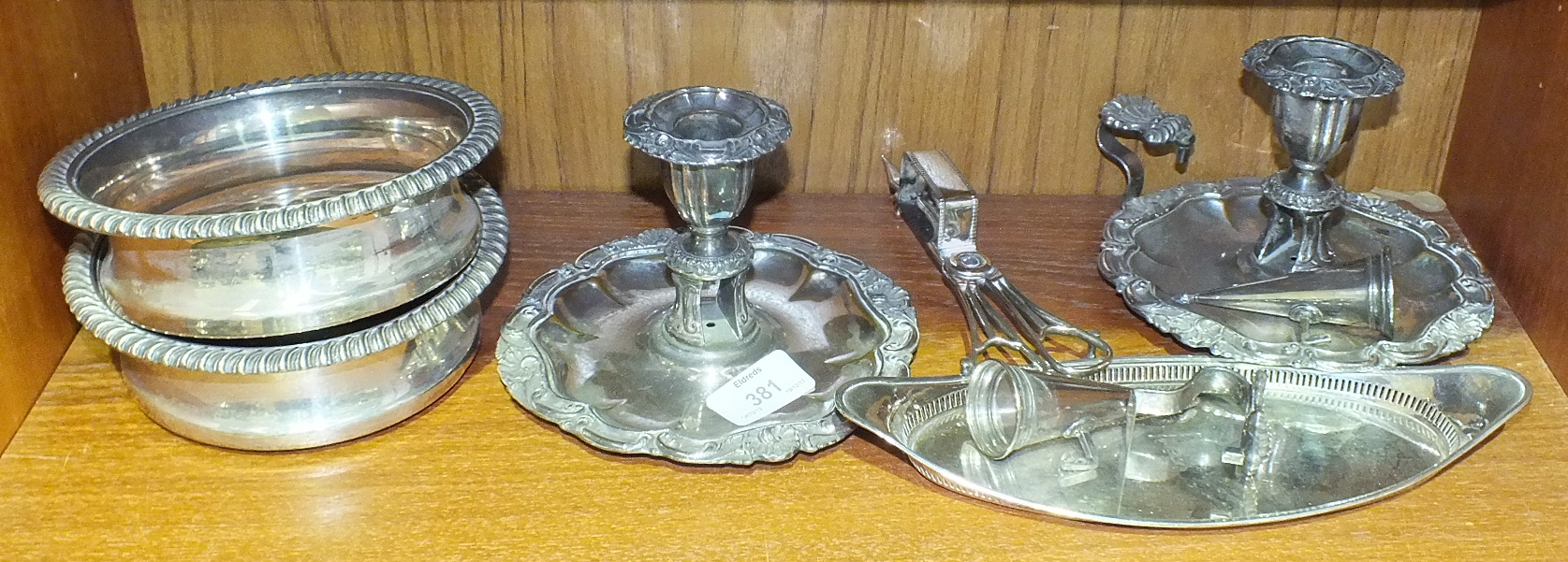A pair of silver plated chamber sticks with embossed rim decoration, on circular bases, with - Image 2 of 2