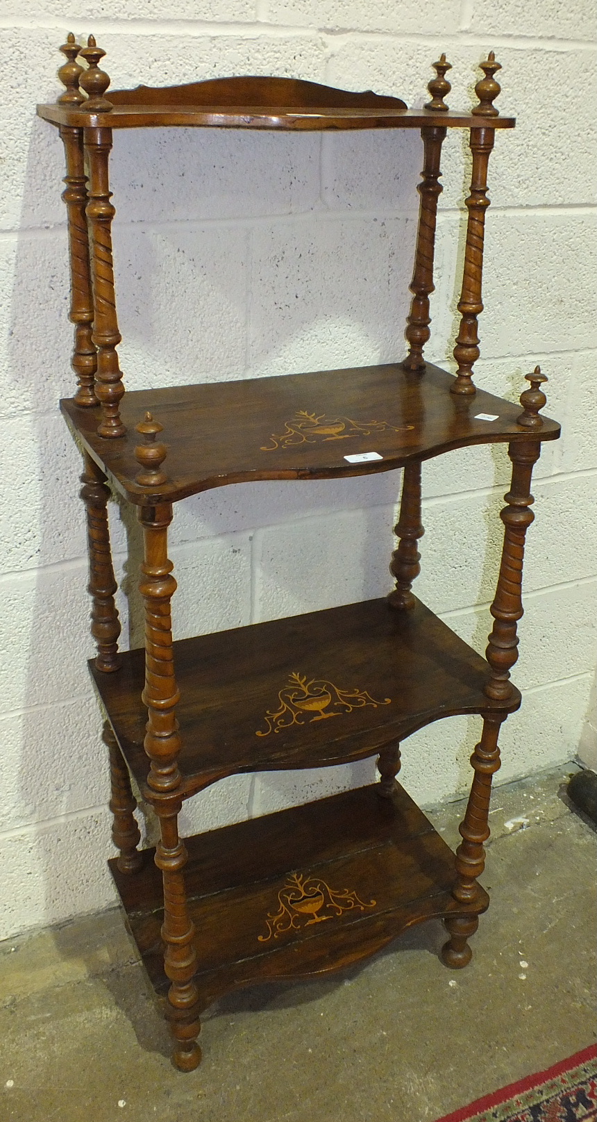 A late-19th century inlaid walnut four-tier watnot, each tier with turned supports, 53cm wide, 132cm