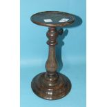 A Georgian mahogany adjustable candle stand with turned column, on weighted circular base, 31cm,