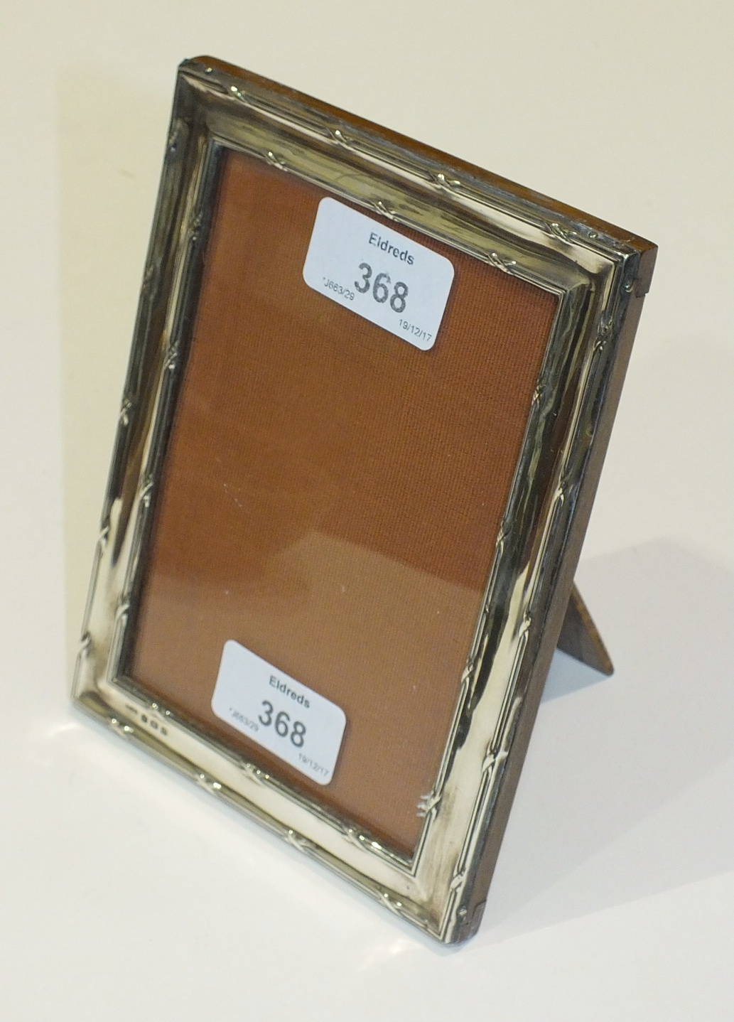 A silver rectangular photograph frame, Birmingham 1913, 17 x 12.5cm.