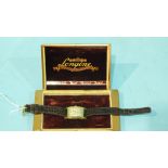 Longines, a gent's 14ct gold tank watch on leather strap, boxed, (not working).