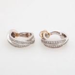 CARTIER klassische Ohrclips in Creolenform m. Brillanten in WG 18K. L: ca. 23mm, B: ca. 6,5mm.