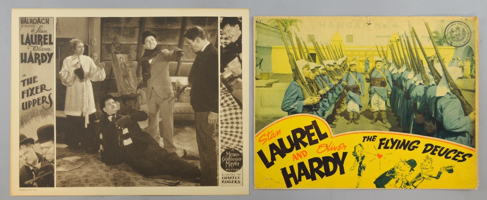 Laurel and Hardy - Two US Lobby cards, The Fixer Uppers (1935) & The Flying Deuces (1939), 10 x 13 &