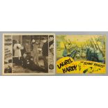Laurel and Hardy - Two US Lobby cards, The Fixer Uppers (1935) & The Flying Deuces (1939), 10 x 13 &