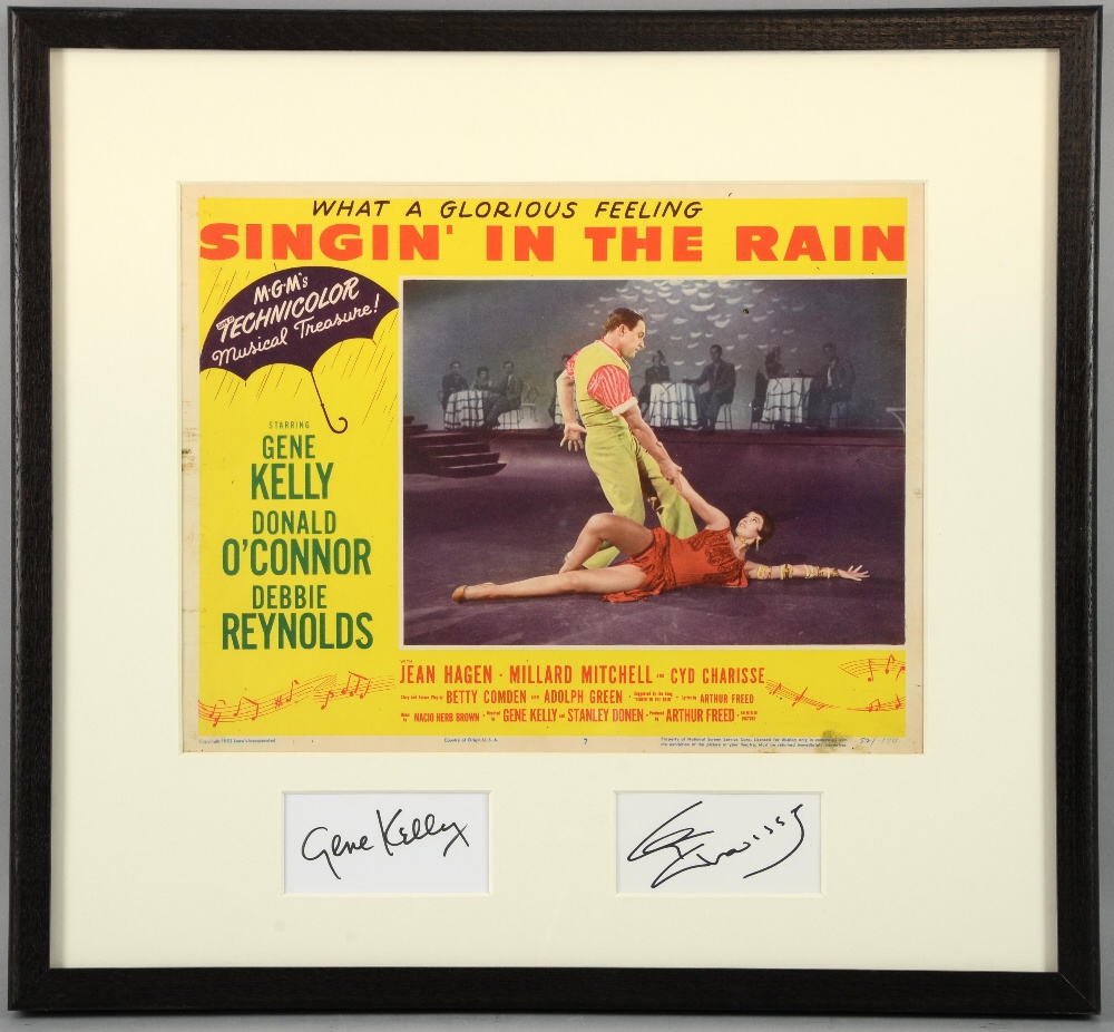 Singin' In The Rain (1952) US Lobby card, mounted with signatures of Gene Kelly & Cyd Charisse, - Image 2 of 2