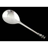 Arts and Crafts anointing spoon with planished bowl and acanthus leaf terminal, the end engraved