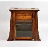 Arts and Crafts smokers oak cabinet with parquetry panel of a seated fisherman. 33cm high x 18cm