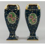 Pair of Secessionist Ernst Wahliss, Vienna vases, decorated with floral cartouche on a high blue