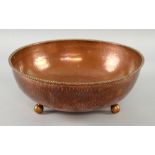 Dryad, Leicester, an Arts and Crafts copper bowl, planished finish, rope twist rim, raised on