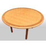 Martin Grierson table, with birds eye maple table and darker banding, on round section legs, made