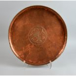 Hugh Wallis Arts & Crafts copper tray with central decoration of leaves and berries, stamped