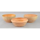 Three Compton pottery bulb bowls, ribbed form, unglazed exterior, all with Compton impressed stamps,