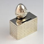 Modern silver novelty 'Humpty Dumpty' money box, modelled sitting on the wall, by Cohen & Charles,