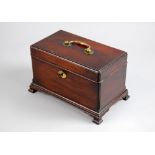 George III mahogany tea caddy opening to reveal three sectioned compartments (covers lacking) on