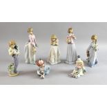 Lladro figurines to include two clowns, boy with dog, and girls with flowers, (7),