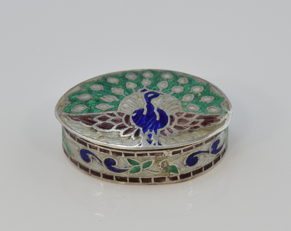 Sterling silver and enamelled oval pill box with peacock decoration, marked '925', 3.5cm wide,