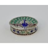 Sterling silver and enamelled oval pill box with peacock decoration, marked '925', 3.5cm wide,