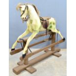 A painted rocking horse, 113cm high,