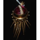 VICTORIAN PINCHBECK OVAL PURPLE CABOUCHON & PEARL PENDANT WITH ARTICULATED TASSELS.