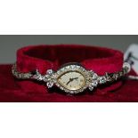 BULOVA 14CT WHITE GOLD LADIES COCKTAIL WRISTWATCH SET WITH DIAMONDS AROUND THE CASE AND IN THE