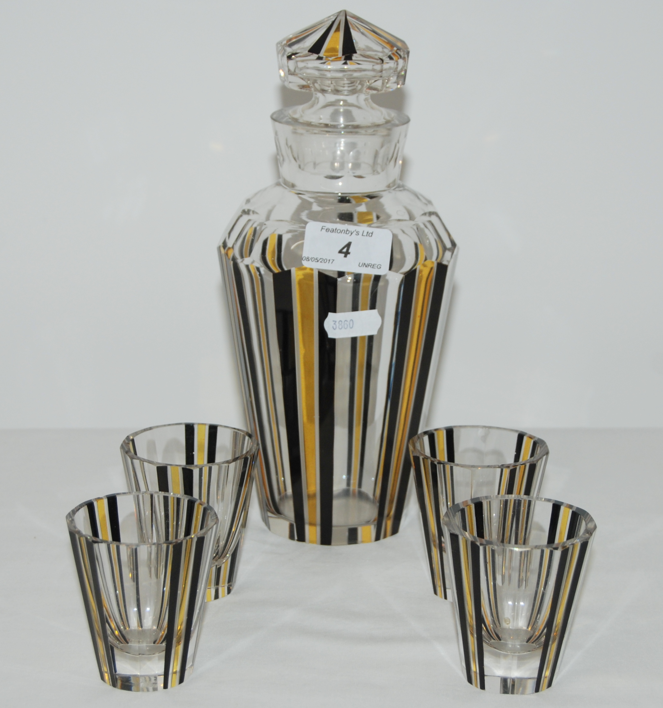 1930'S ART DECO FACETED GLASS DECANTER & 4 GLASSES WITH BLACK AND YELLOW STRIPES.