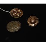 2 ANTIQUE PINCHBECK BROOCHES AND 1 OTHER OVAL BROOCH WITH POSSIBLY ISLAMIC SCRIPT ON IT.
