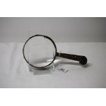 LARGE VICTORIAN SILVER MAGNIFYING GLASS WITH CHASED & ENGRAVED FOLIATE & MASK DECORATION,