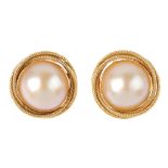 A pair of mabe pearl earrings. Each designed as a mabe pearl, within an interlocking rope-twist