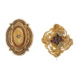 Two 19th century brooches. The first designed as an early 19th century amethyst stylised bunch of