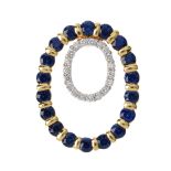 A sapphire and diamond pendant. Designed as a brilliant-cut diamond oval hoop, with a circular-shape