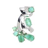 An emerald and diamond spray brooch. Designed as a series of graduated oval emerald cabochons,