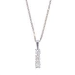 An 18ct gold diamond pendant. The brilliant-cut diamond line, suspended from a tapered surmount