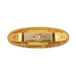 A late Victorian 15ct gold diamond brooch. Of oval outline, the old-cut diamond, star-set to the