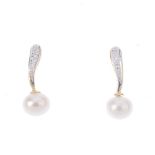 A pair of cultured pearl and diamond earrings. Each designed as a cultured pearl, with a single-