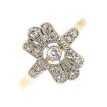 An early 20th century diamond dress ring. Of openwork design, the circular-cut diamond collet,