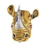 A diamond and gem-set novelty brooch. Of bi-colour design, the rhino head, with brilliant-cut