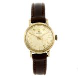 OMEGA - a lady's wrist watch. Yellow metal case, stamped 14k 0,585 with poincon. Numbered 511 138.