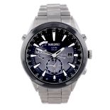 SEIKO - a gentleman's Astron GPS Solar bracelet watch. Titanium case with ceramic bezel. Reference