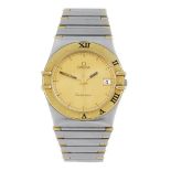 OMEGA - a gentleman's Constellation bracelet watch. Stainless steel case with yellow metal chapter