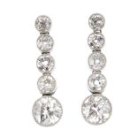 A pair of diamond earrings. Each designed as a graduated circular-cut diamond collet articulated