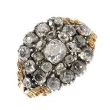 A late Georgian gold and silver diamond cluster ring. The old-cut diamond cluster, slightly raised