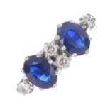 A sapphire and diamond ring. The oval-shape sapphires, with brilliant-cut diamond spacers and sides.