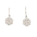 A pair of 18ct gold diamond earrings. Each designed as a brilliant-cut diamond floral cluster,